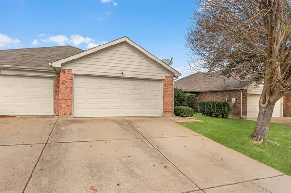 a view of garage yard and tree
