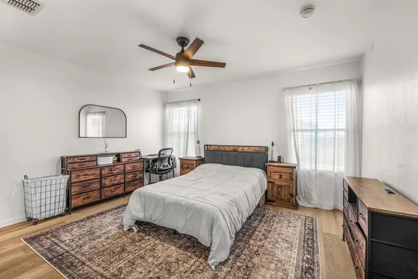 a bed room with a bed and a window