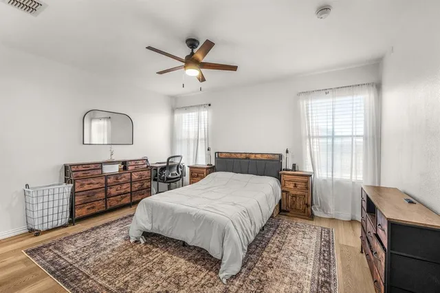 a bed room with a bed and a window