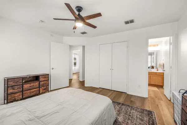 a bedroom with a bed and dresser