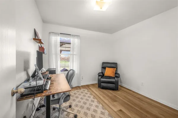 a bedroom with furniture and window