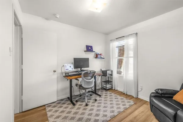 a workspace with furniture and a window