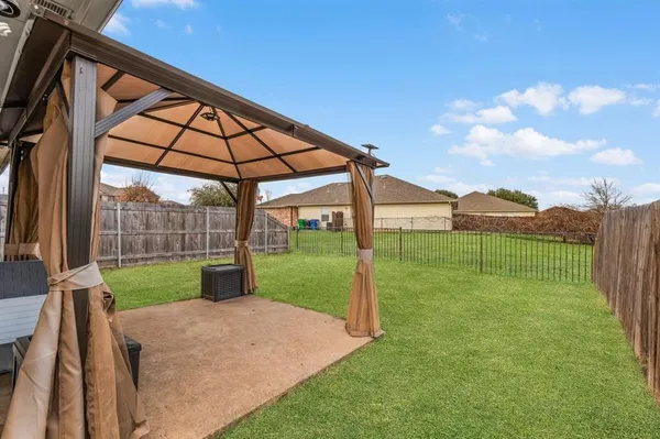 a view of a backyard with a garden