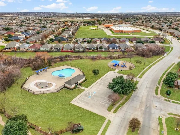 an aerial view of a house with a ocean view