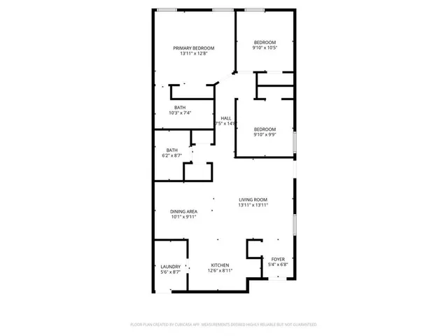 a picture of a bench in front of a wall