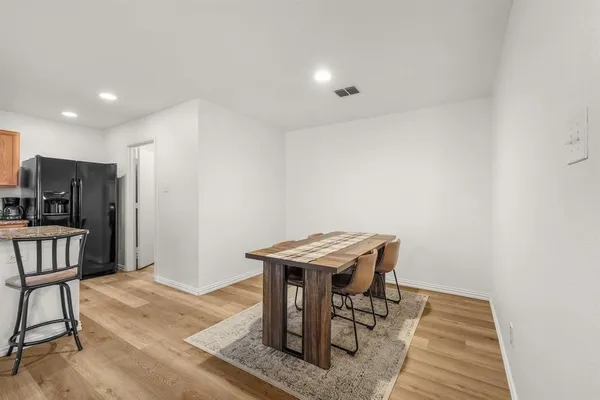 a view of a hallway with seating area