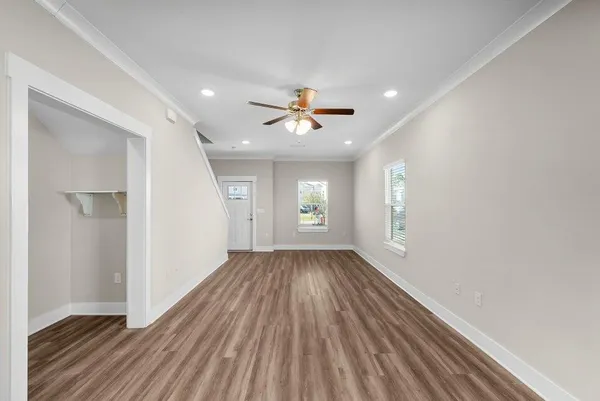 wooden floor in an empty room with a window