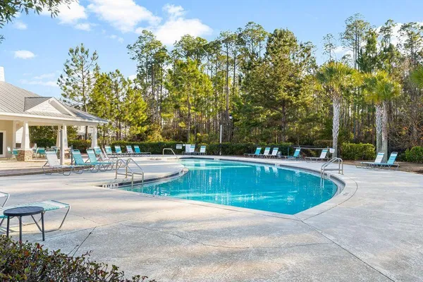 a view of a swimming pool with a patio