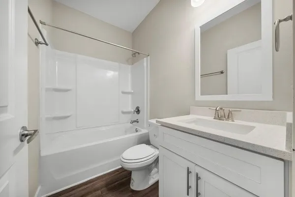 a bathroom with a sink a toilet and a bathtub