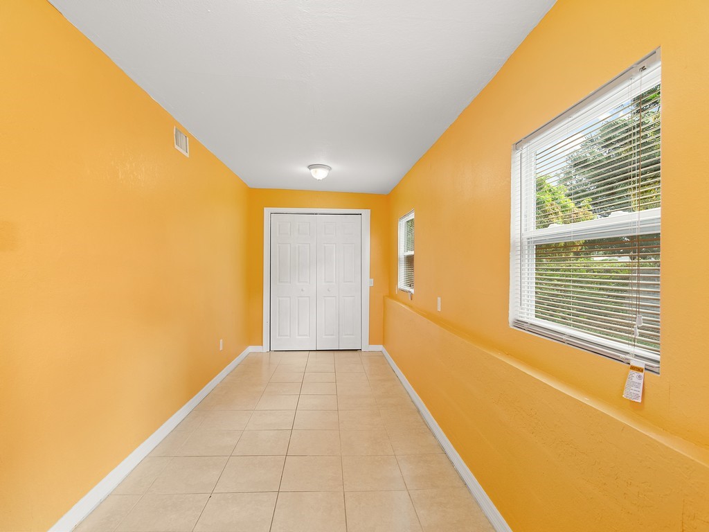 4341 35th Avenue Vero Beach, FL 32967 - Photo 11 of 25 a view of an empty room with a window