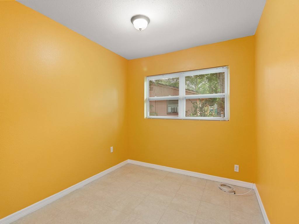 4341 35th Avenue Vero Beach, FL 32967 - Photo 12 of 25 a view of an empty room with a window