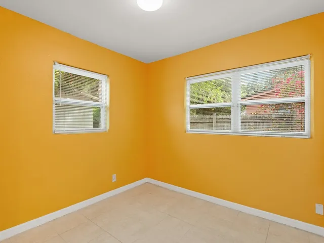 a view of a blue wall with windows