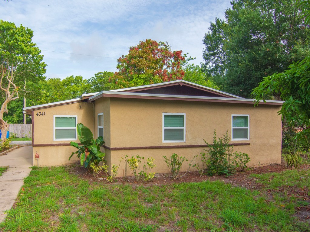 4341 35th Avenue Vero Beach, FL 32967 - Photo 18 of 25 a front view of house with yard and green space