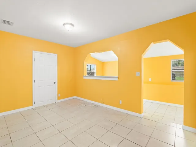 a view of a big room with windows