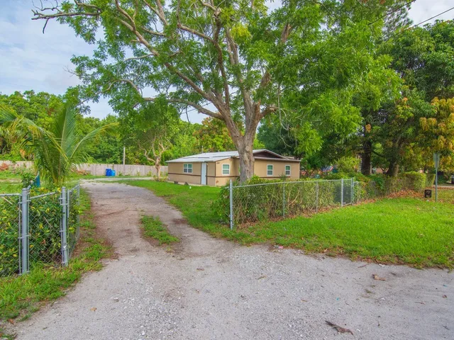 a view of a park with large trees