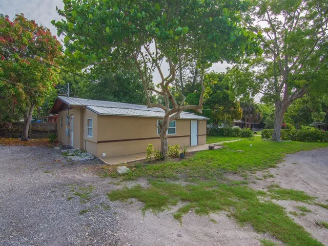 a house view with a backyard space