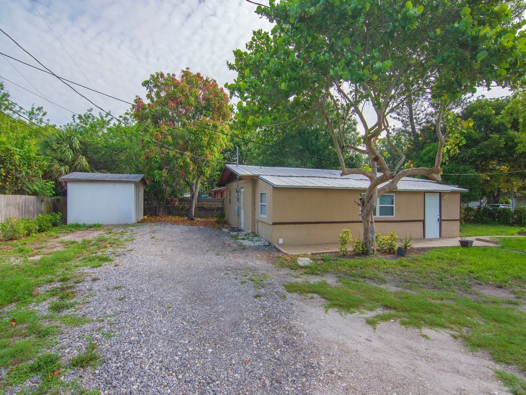 4341 35th Avenue Vero Beach, FL 32967 - Photo 25 of 25 a view of a house with backyard and trees