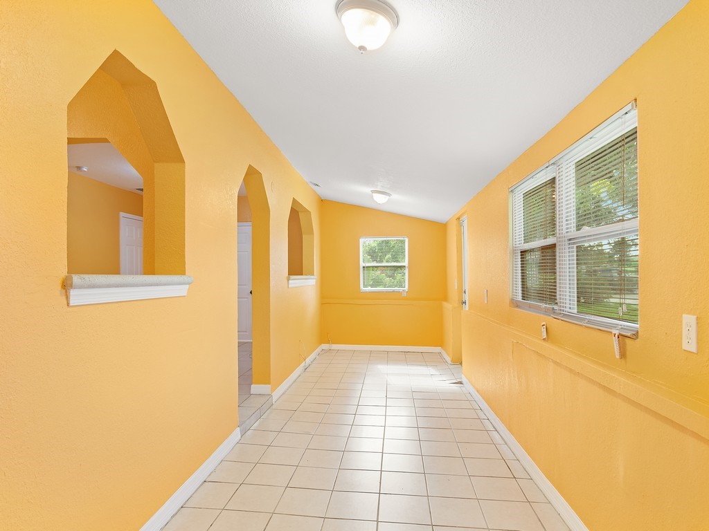 4341 35th Avenue Vero Beach, FL 32967 - Photo 4 of 25 a view of a hallway with windows