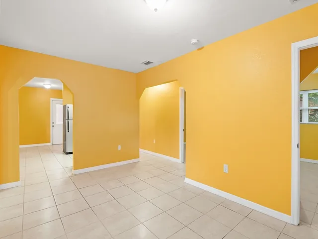 a view of a big room with windows