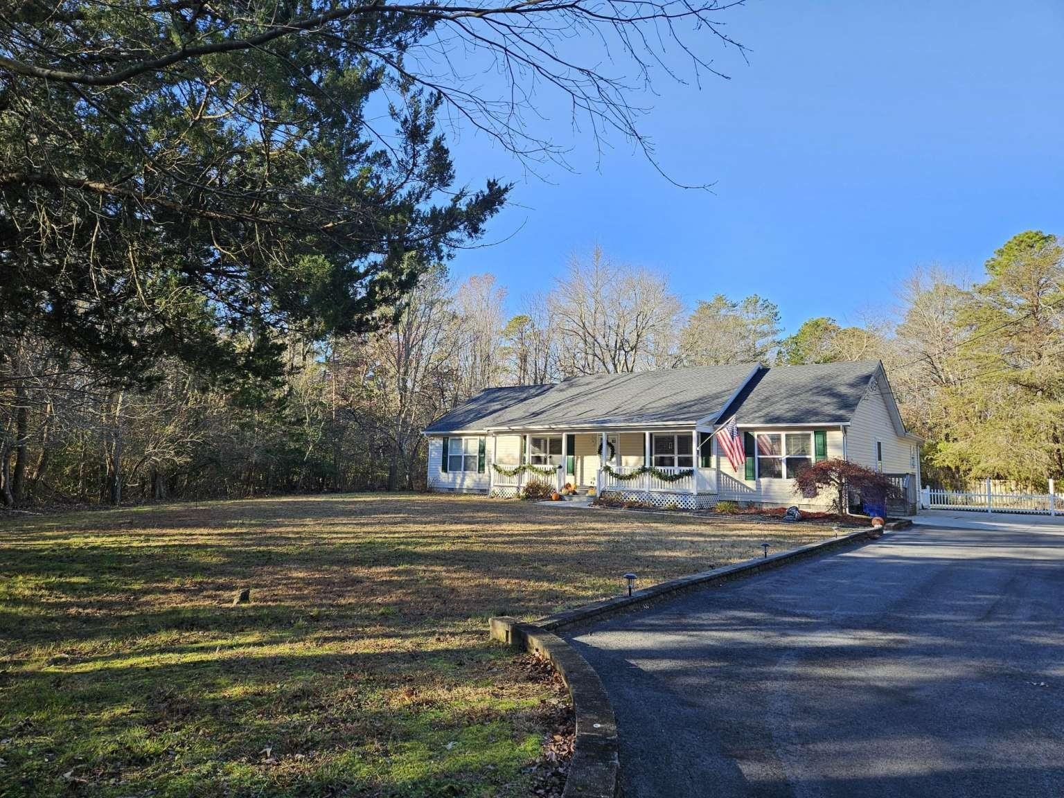 a front view of a building with a garden