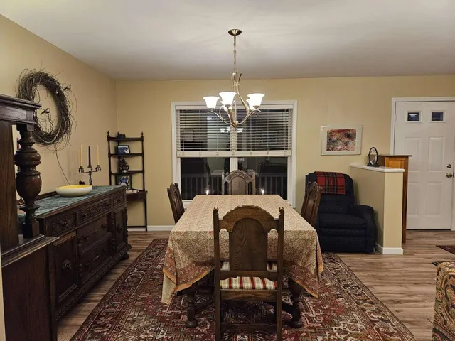a dining room with furniture and window