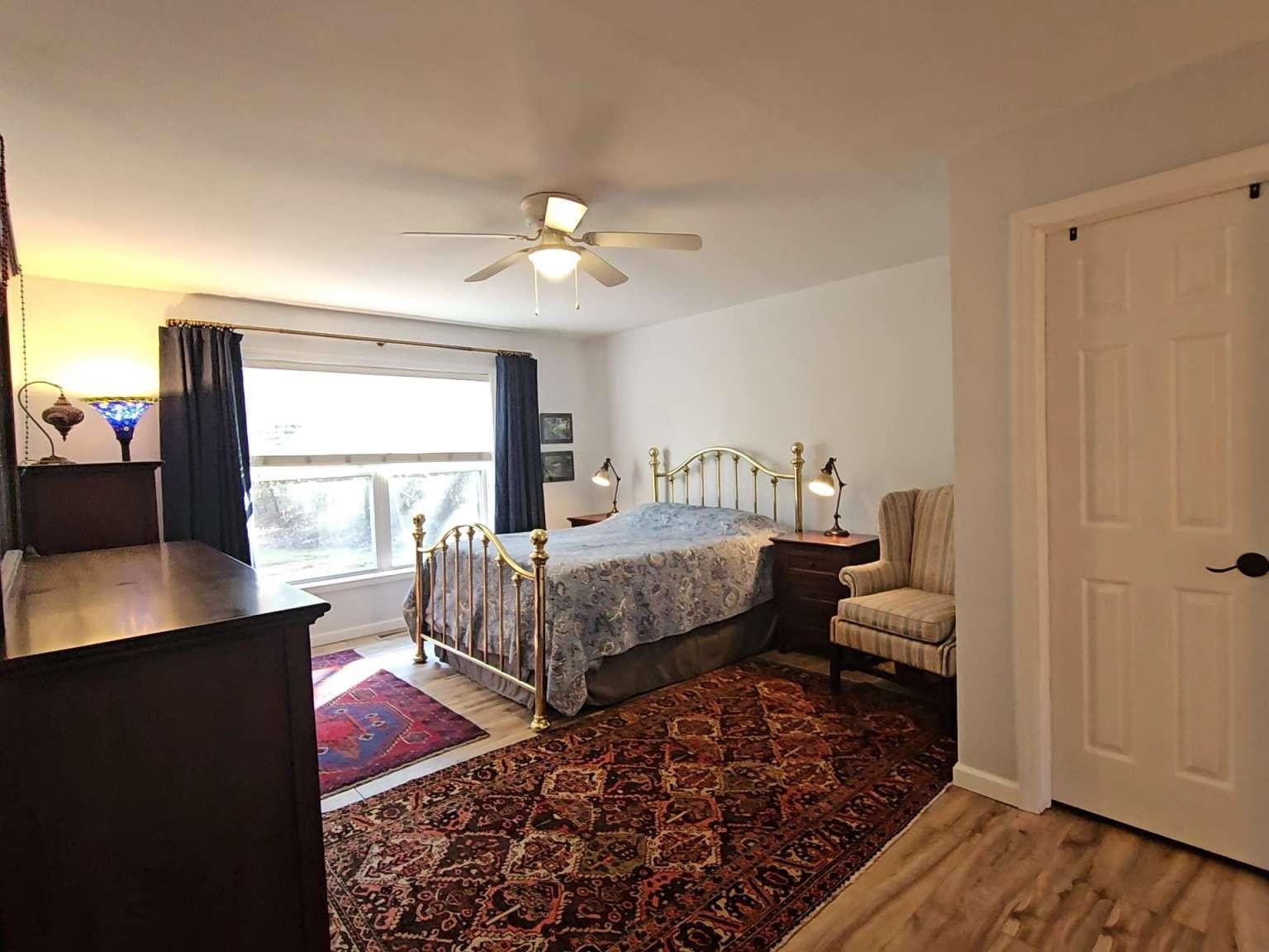 1200 Tyler Road Woodbine, NJ 08270 - Photo 16 of 29 a bedroom with a bed and wooden floor