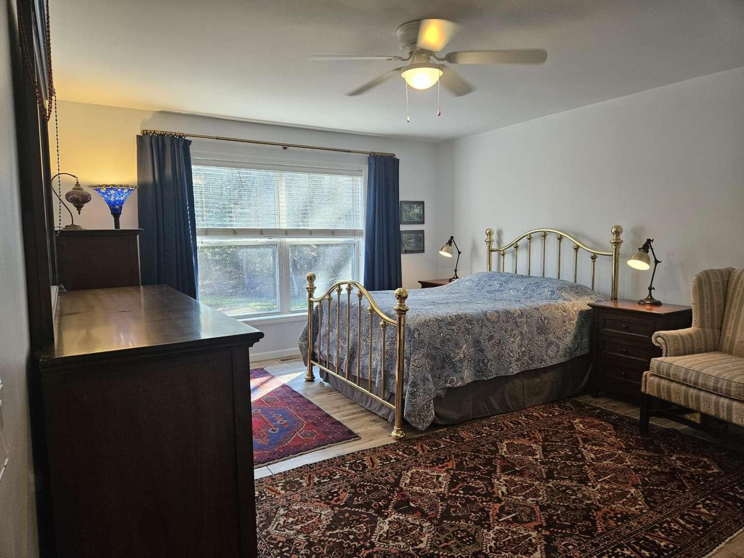 1200 Tyler Road Woodbine, NJ 08270 - Photo 17 of 29 a bedroom with a bed lamps and window