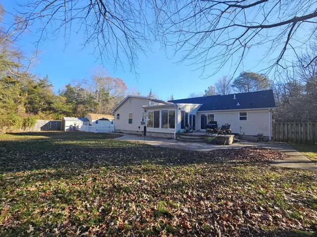 a house view with a backyard space