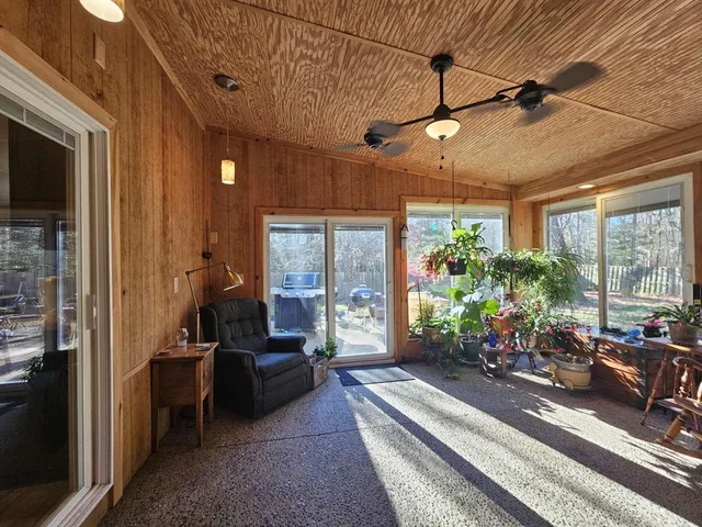 a lobby with furniture and a potted plant