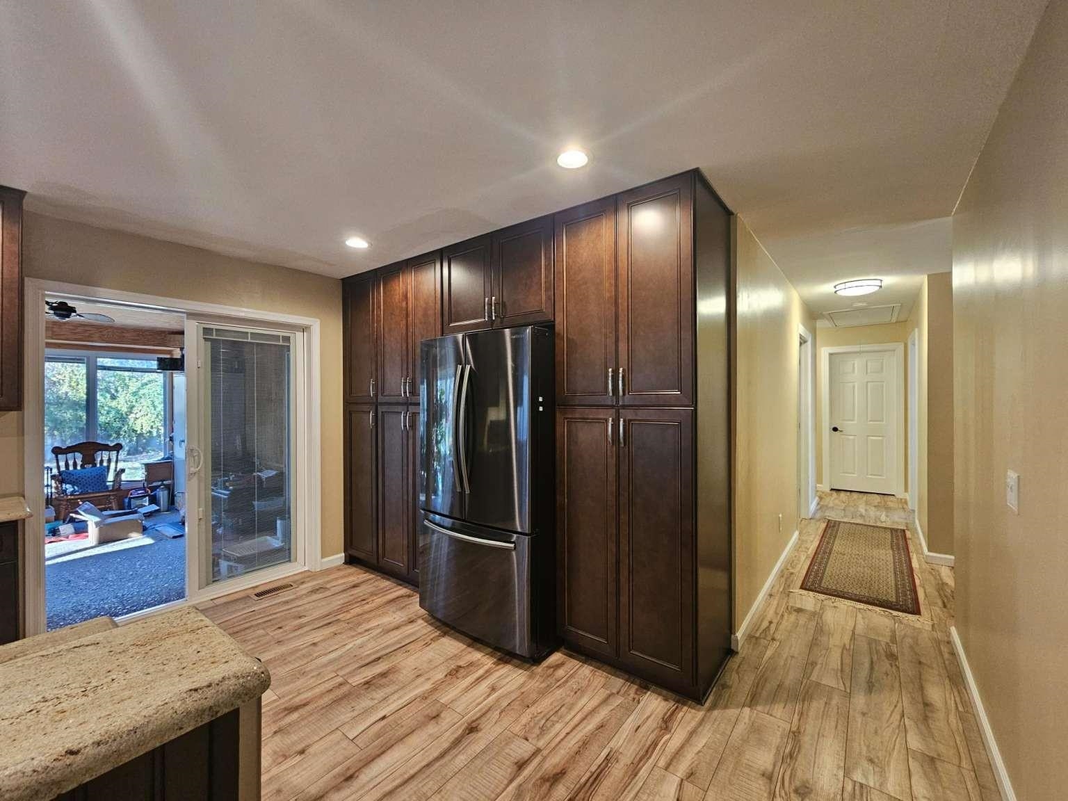 1200 Tyler Road Woodbine, NJ 08270 - Photo 8 of 29 a view of kitchen island wooden floor and a refrigerator