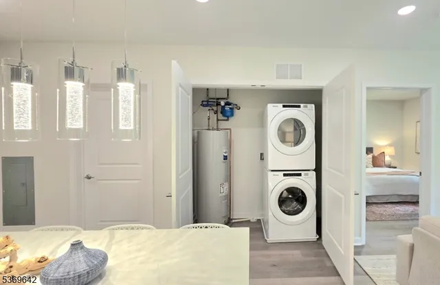 a bedroom with a washer and dryer