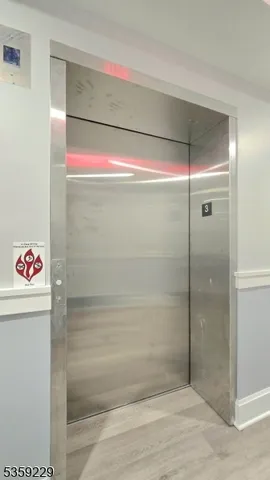 a bathroom with a shower and a sink