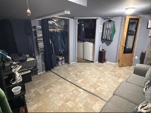 a bed room with a bed and a mirror