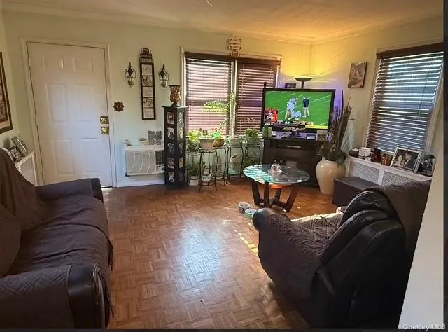 a living room with furniture window and flat screen tv
