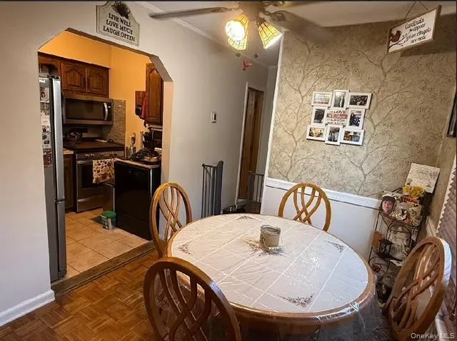 a dining room with furniture and window