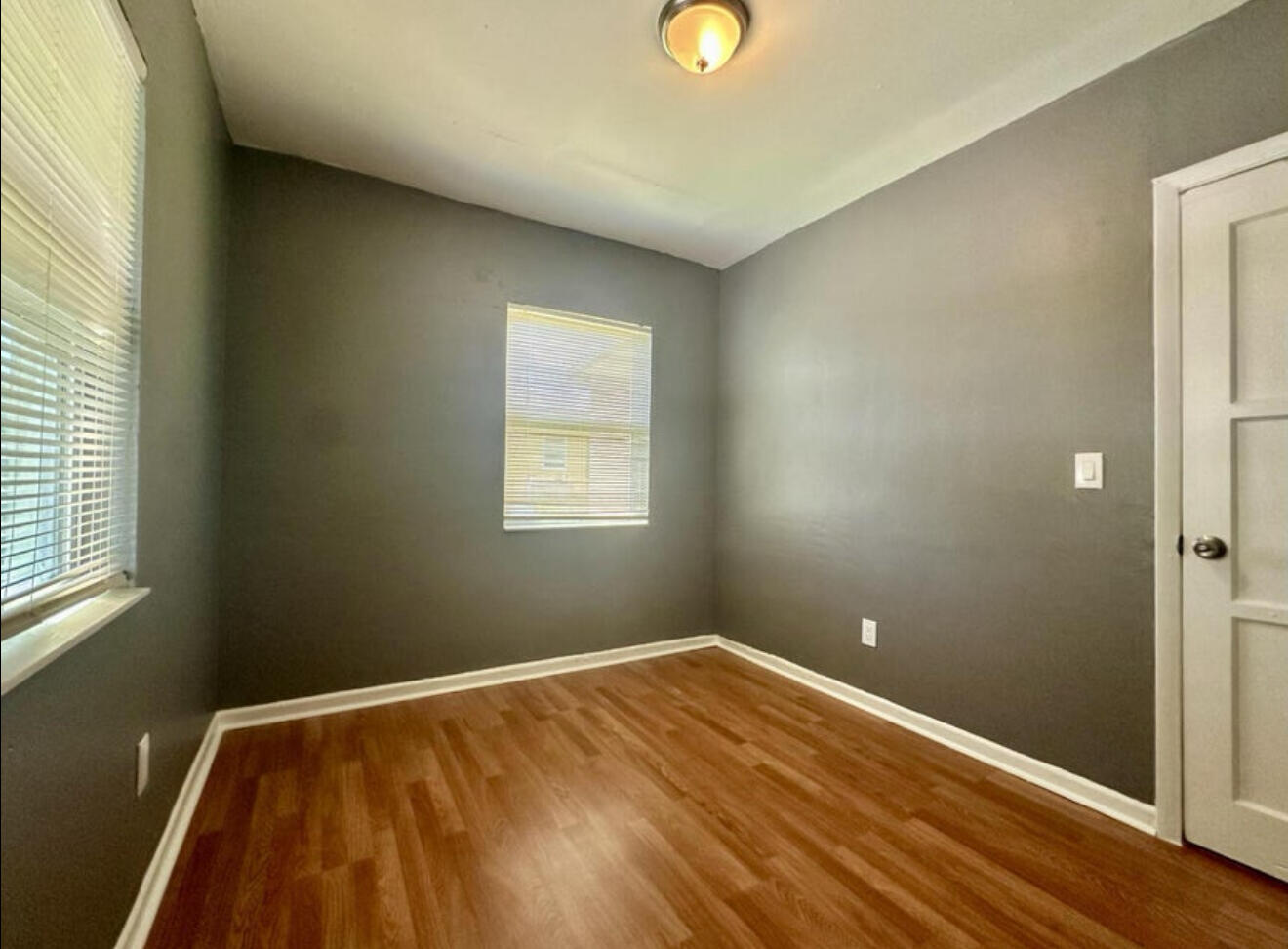 24 Southwest 10th Avenue Delray Beach, FL 33444 - Photo 17 of 25 a view of a room with wooden floor and windows
