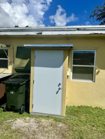 a small pool with a outdoor seating