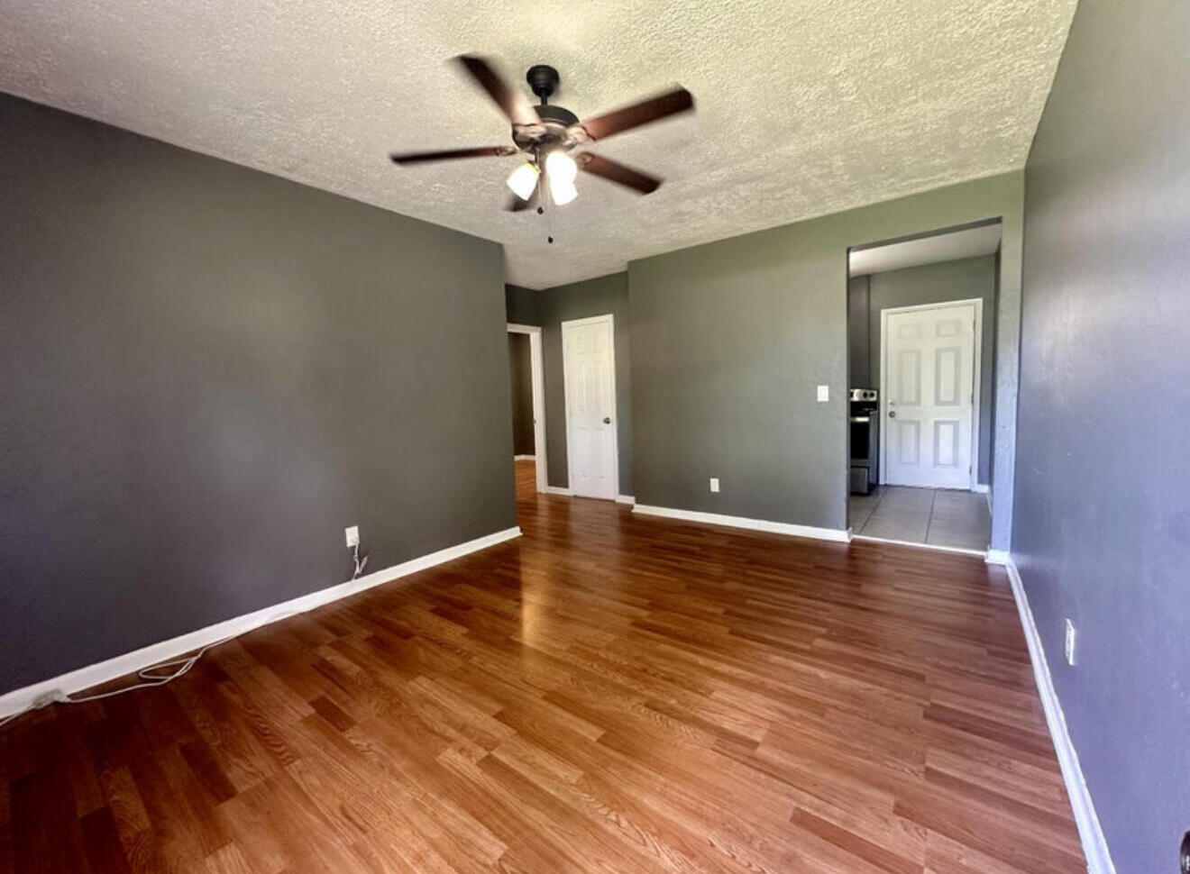 24 Southwest 10th Avenue Delray Beach, FL 33444 - Photo 4 of 25 wooden floor in an empty room with a window
