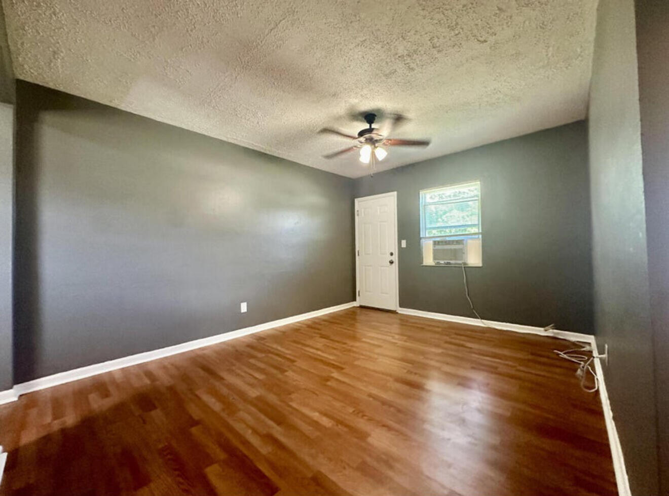 24 Southwest 10th Avenue Delray Beach, FL 33444 - Photo 5 of 25 a view of an empty room with a window