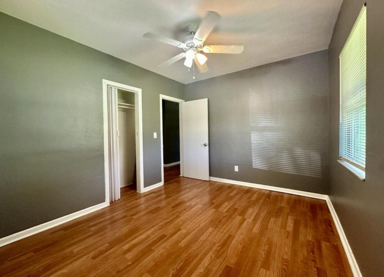 24 Southwest 10th Avenue Delray Beach, FL 33444 - Photo 10 of 25 wooden floor in an empty room with a window