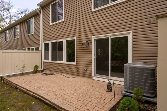 a view of a house with a balcony and door