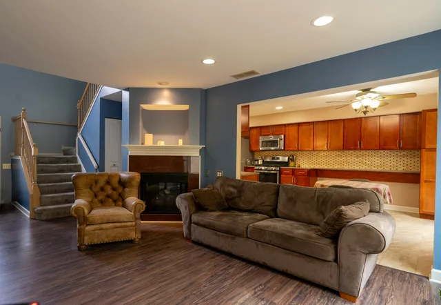 a living room with furniture and a fireplace