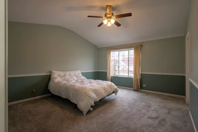 a bed room with a bed and a window