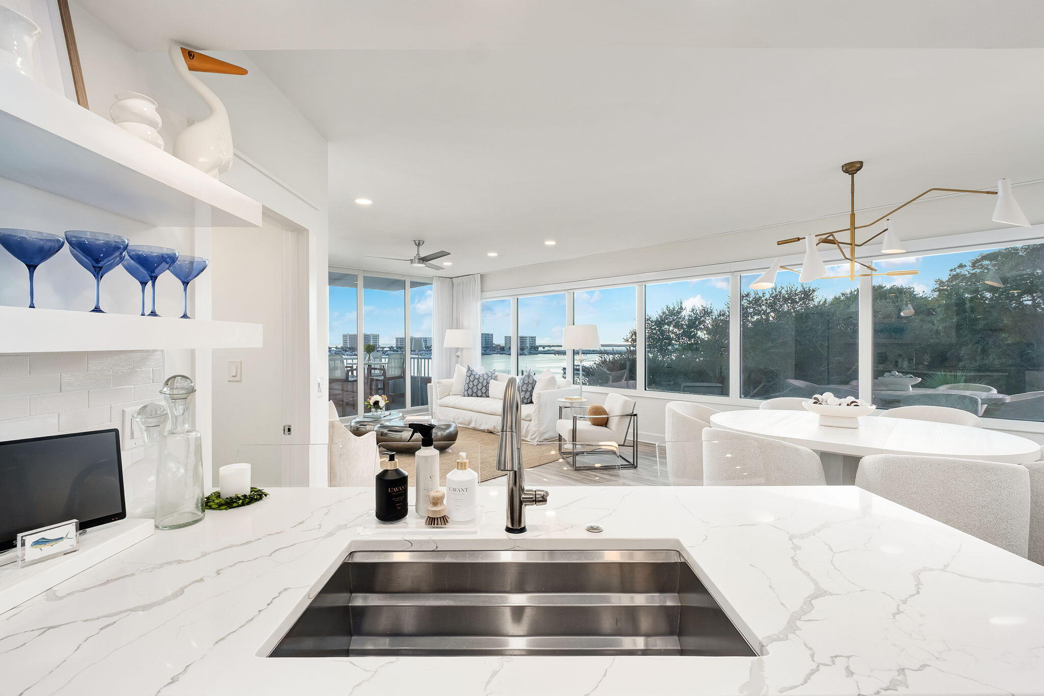 320 Harbor Boulevard, Unit A305 Destin, FL 32541 - Photo 13 of 71 a living room with furniture a fireplace and a chandelier