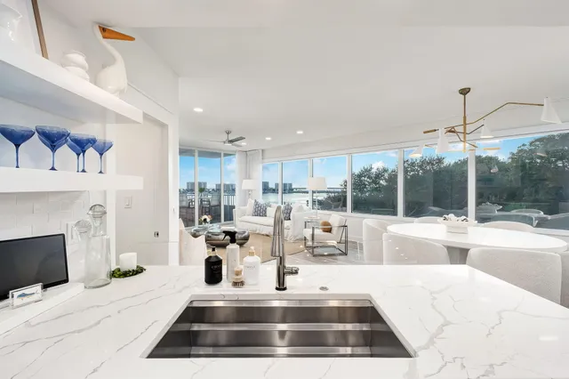 a kitchen with kitchen island cabinets and refrigerator