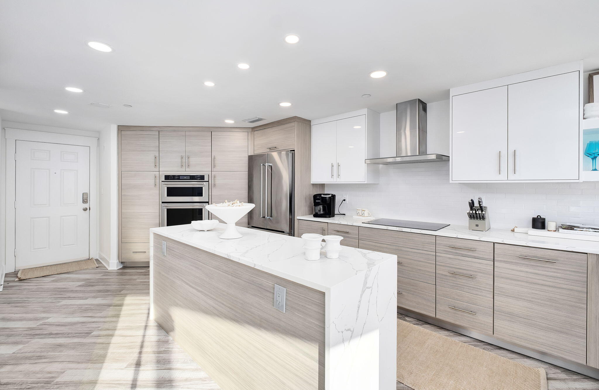 320 Harbor Boulevard, Unit A305 Destin, FL 32541 - Photo 17 of 71 a kitchen with kitchen island cabinets and refrigerator