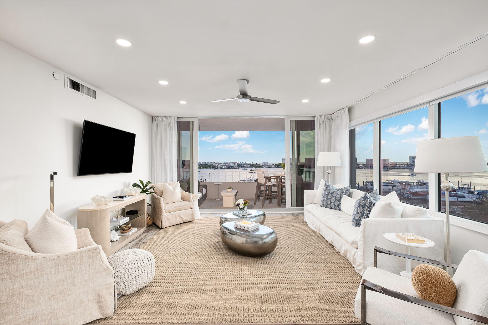 320 Harbor Boulevard, Unit A305 Destin, FL 32541 - Photo 22 of 71 a living room with furniture and a flat screen tv