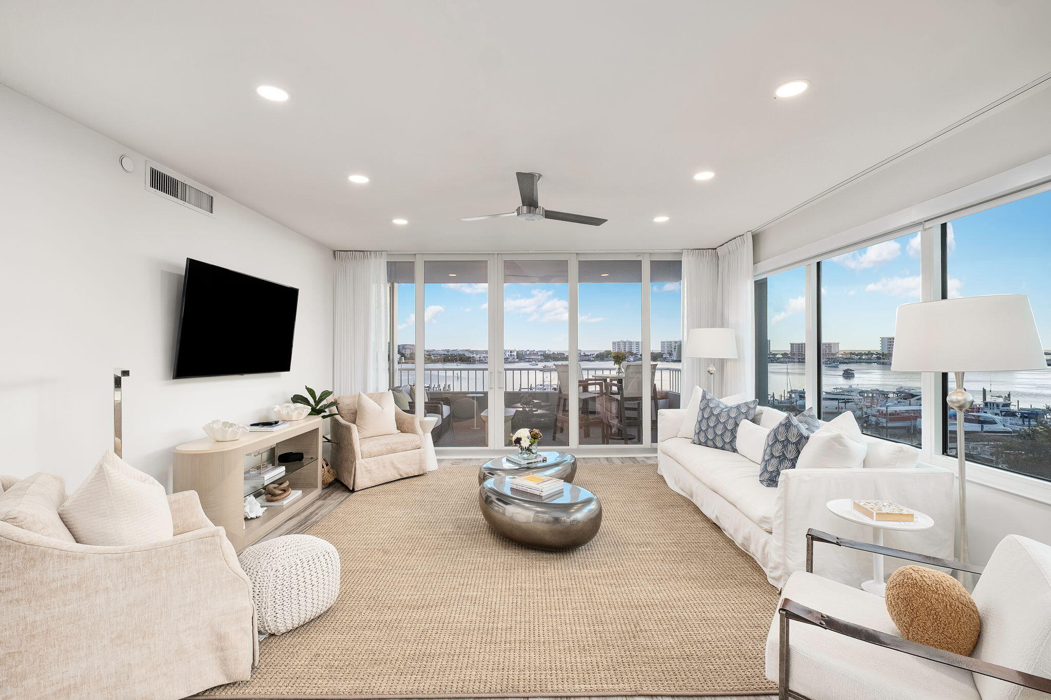 320 Harbor Boulevard, Unit A305 Destin, FL 32541 - Photo 24 of 71 a living room with furniture and a flat screen tv