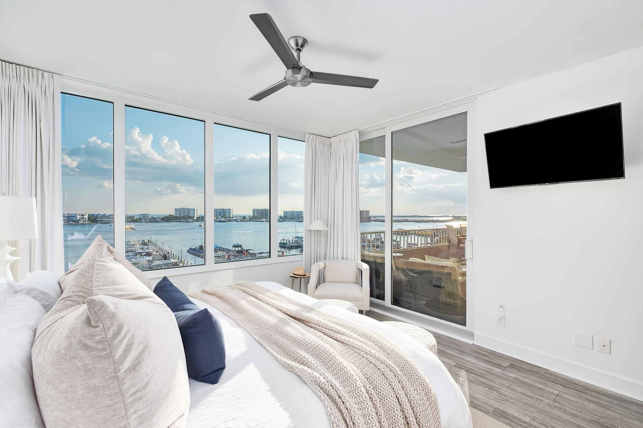 320 Harbor Boulevard, Unit A305 Destin, FL 32541 - Photo 27 of 71 a large bedroom with a large bed and a large window