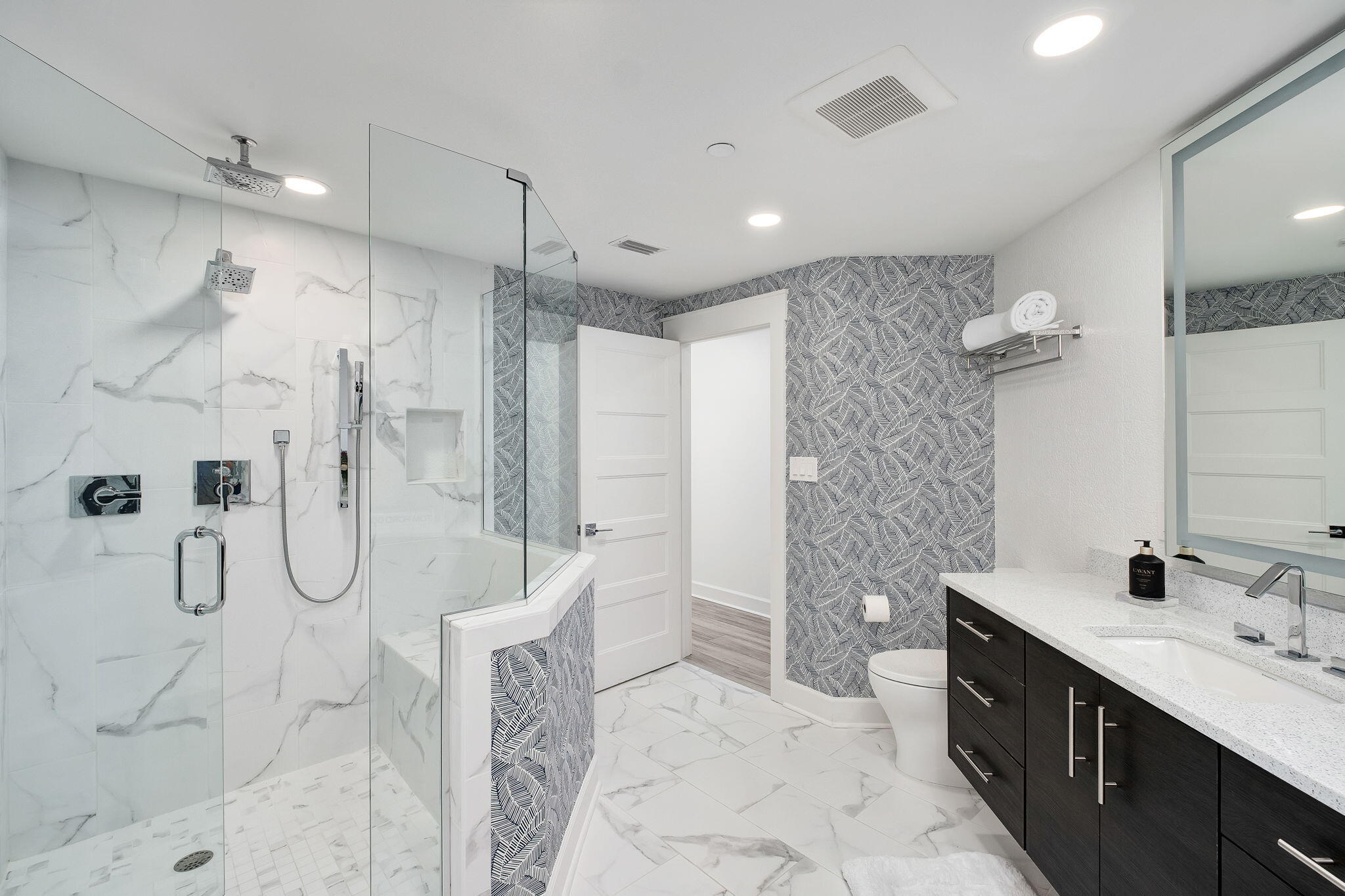 320 Harbor Boulevard, Unit A305 Destin, FL 32541 - Photo 31 of 71 a bathroom with a double sink shower and a mirror